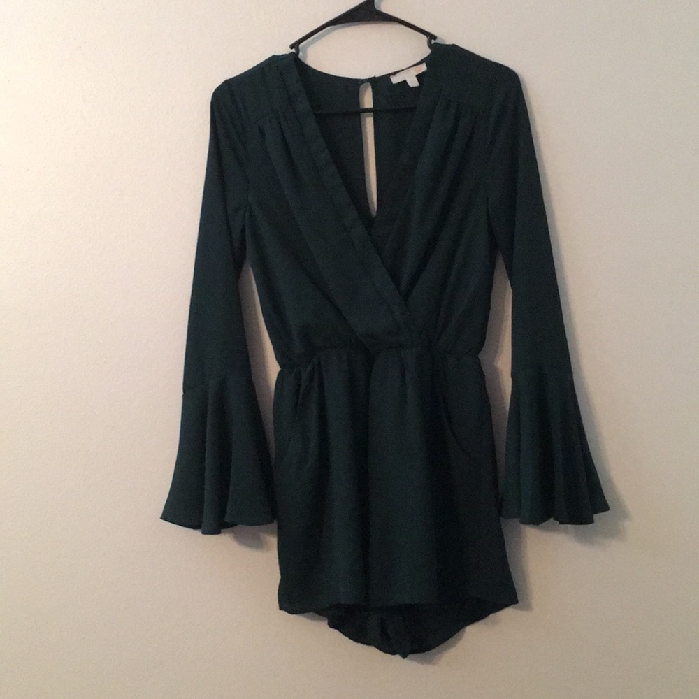 Forest green v-neck romper with pockets.